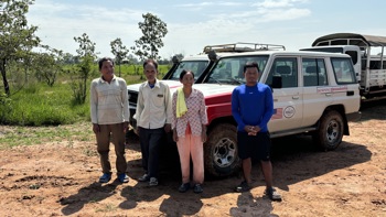Yul Hai, Cham Sophal, Po Sarin and Liang Sorphea pose infront of a HALO vehicle outside