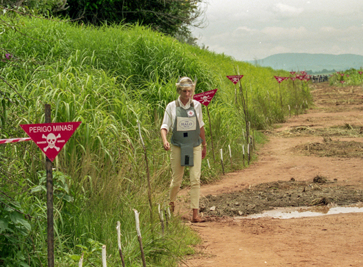 Princess Diana walking through a minefield in Angola in 1997
