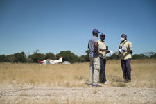 HALO staff in front of a small plane