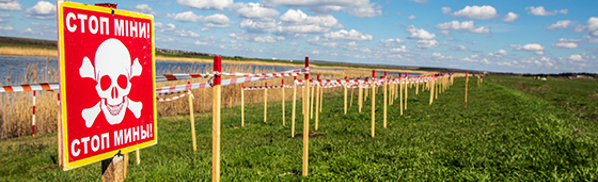 A minefield in Mykolaiv oblast is lined with mine warning signs
