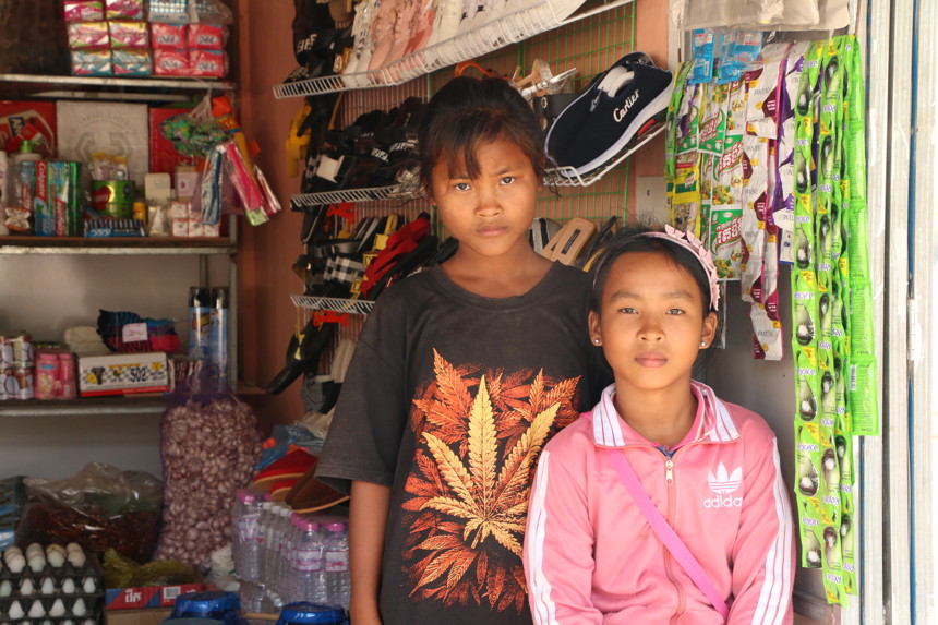 Children from Ha Leam Sen Chey Primary School stand in a convenience shop