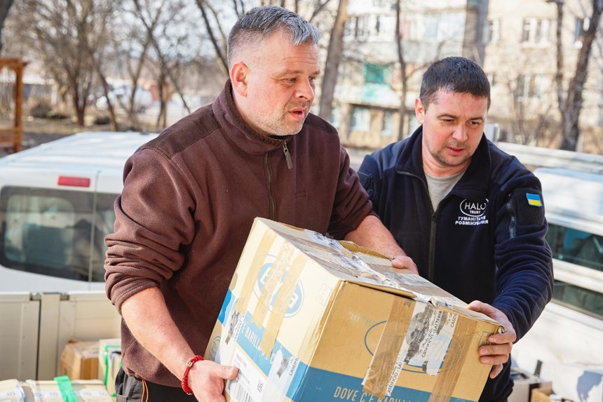 HALO staff carry boxes in Ukraine