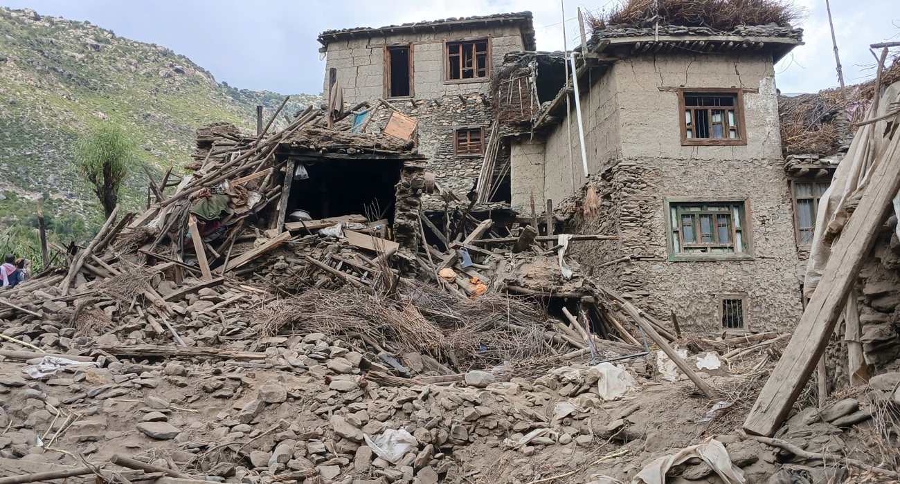 The wreckage of a building partially destroyed by an earthquake.