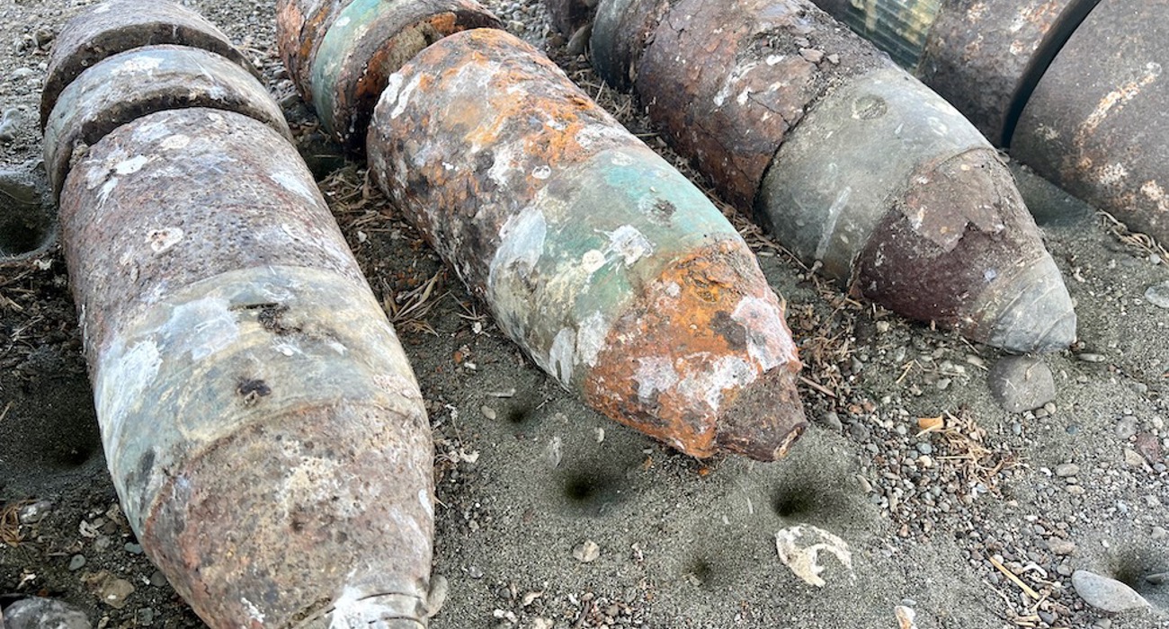 A collection of rusted US six-inch practice projectiles