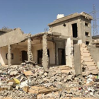 A destroyed house surrounded by rubble in Sirte, Libya