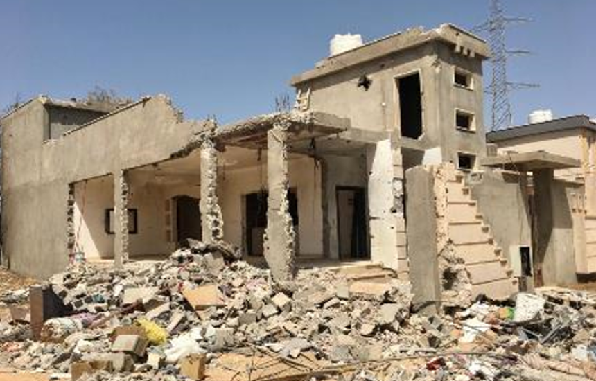 A destroyed house surrounded by rubble in Sirte, Libya