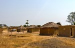 A row of houses in a field.