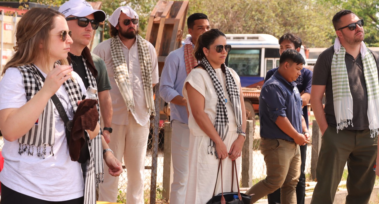 US Congressional staffers stand outside with Cambodian HALO staff
