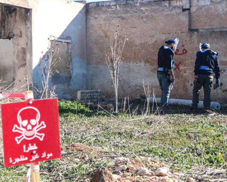 HALO's explosive ordinance team check a 220mm urgan thermobaric rocket in Luf village