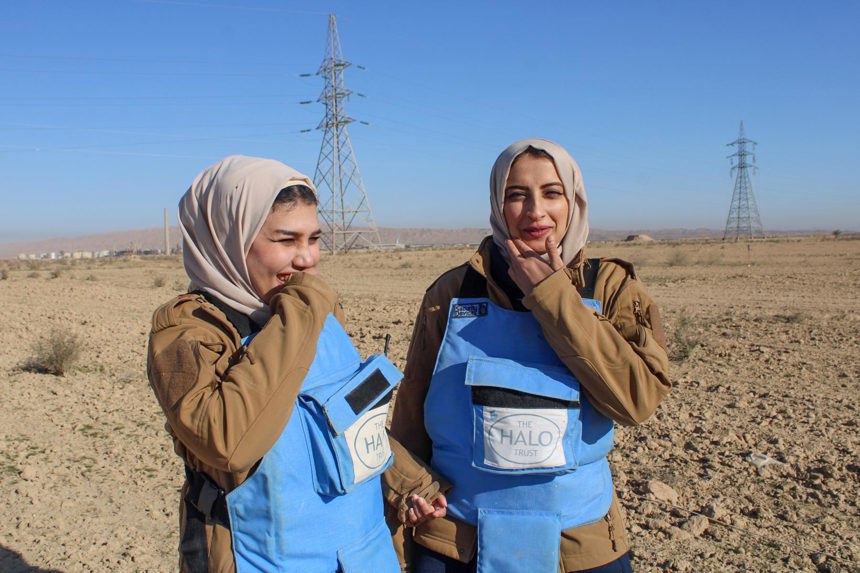 Safa and Elaf, wear HALO uniform and PPE in a minefield in Iraq