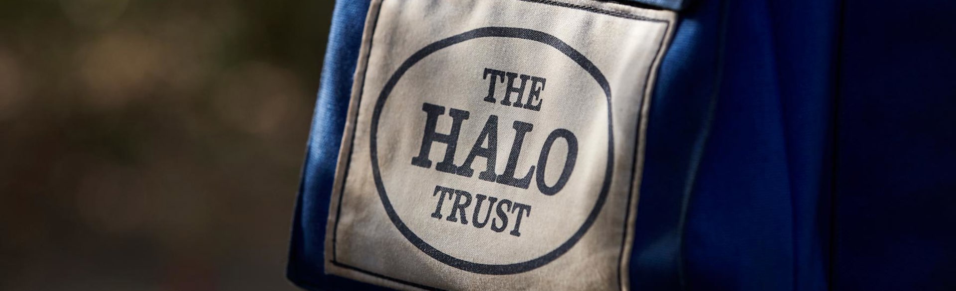 A protective vest displaying The HALO Trust logo on a deminer in Sri Lanka