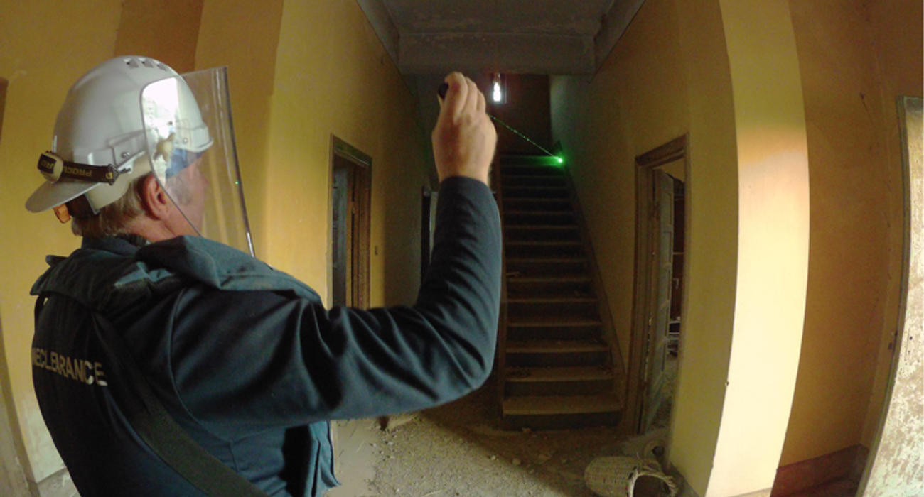 HALO staff member enters the church for the first time, holding a torch and wearing a visor