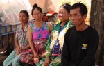 Internally displaced people of the Siem Reap Province sit outside