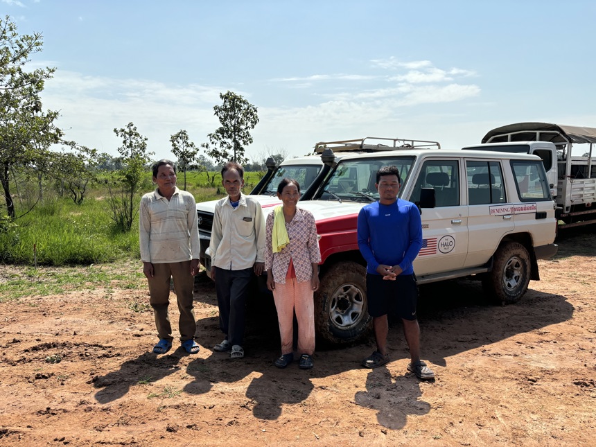 Yul Hai, Cham Sophal, Po Sarin and Liang Sorphea pose infront of a HALO vehicle outside