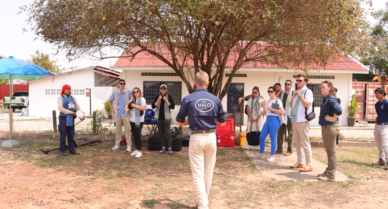 US Congressional staffers listen to a member of HALO staff talking outside