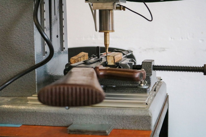 A gun being marked by a machine in Bosnia Herzegovina