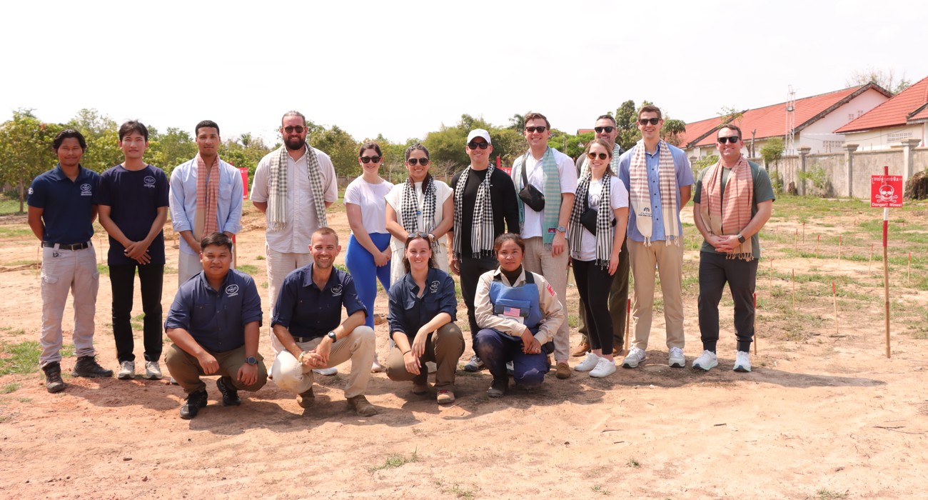US Congressional staffers pose outside with Cambodian HALO staff
