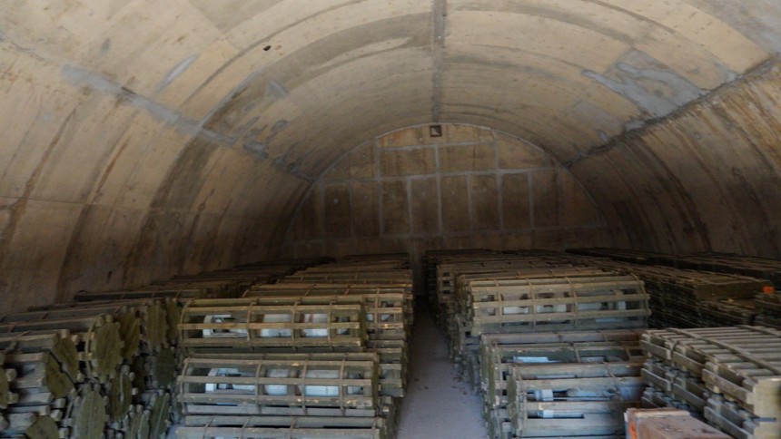 Weapons sit stored in secure armoires