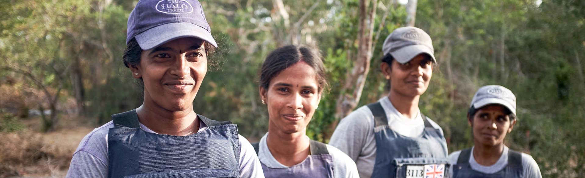 Women from Sri Lankas demining team pose in a line outside