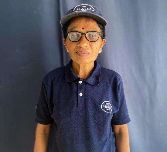 Srisakthi, a completion survey officer stands straightforward wearing HALO's uniform