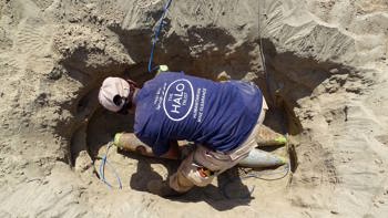 A HALO deminer prepares a hole filled with rockets for demolition in the frontline city of Taiz, Yemen