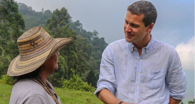 Craig Kowalik meets with a local from the Kwet Wala Indigenous Reserve