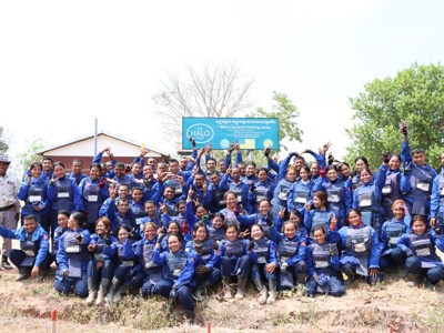 Un Ek smiles with national recruits at HALO's mine clearance training centre in Cambodia