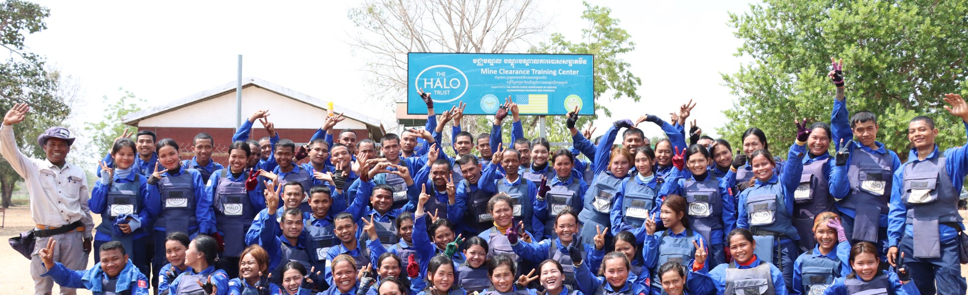 Un Ek smiles with national recruits at HALO's mine clearance training centre in Cambodia