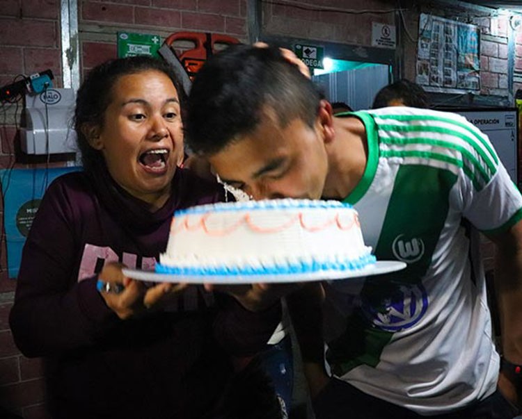 A boy and girl celebrate a birthday with a cake