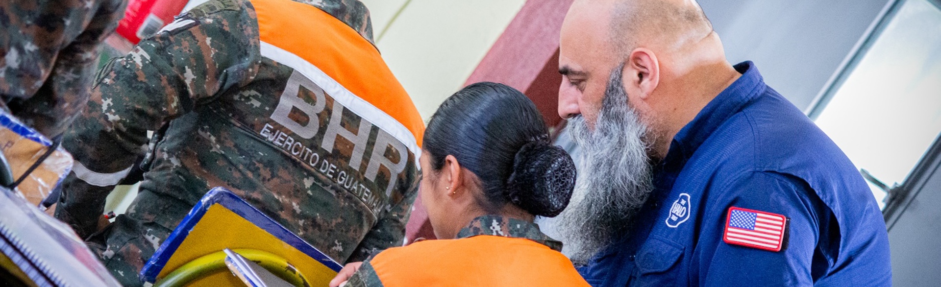 Guatemalan army personnel sit at desks to take the armoury store keeper and manager courses