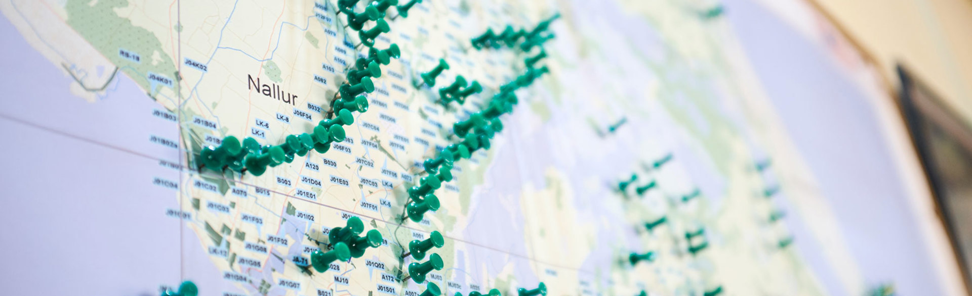 A map of Sri Lanka with pins dotted around it