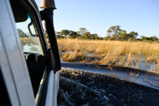 A vehicle navigating flooded ground in Angola