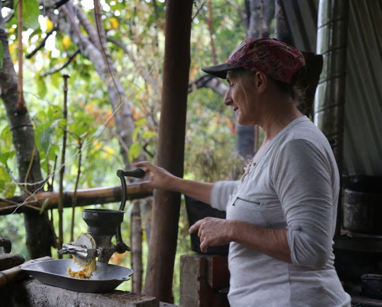 Woman processing coffee on a farm