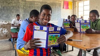 Children in a classroom receive an Explosive Ordnance Risk Education session in Zimbabwe