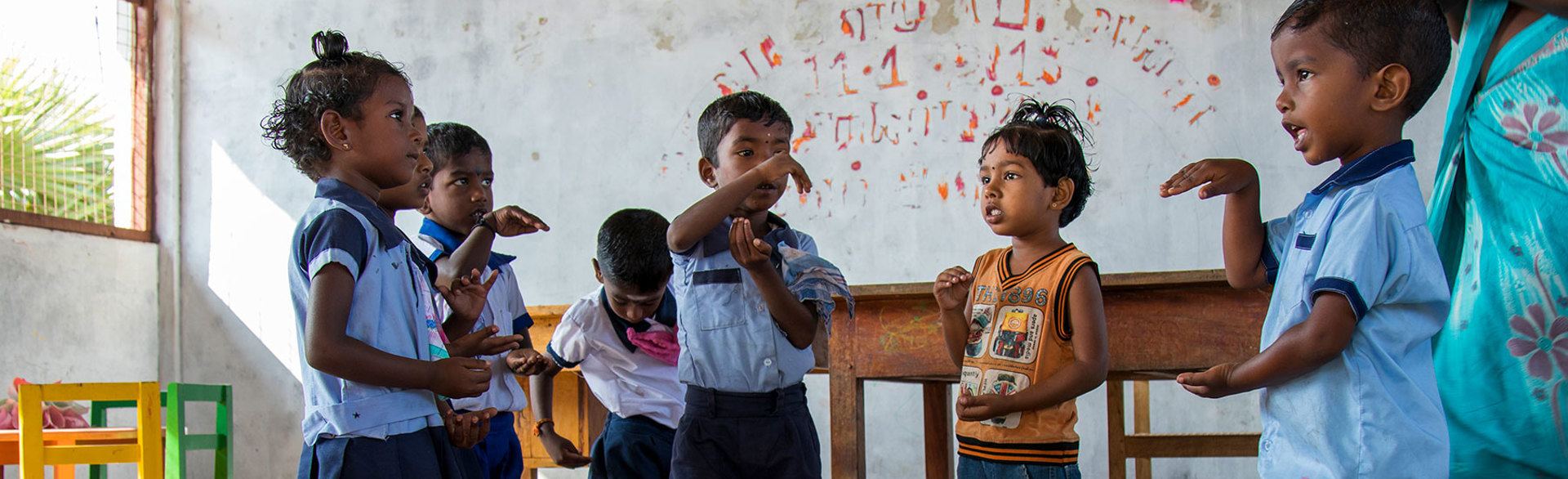A group of children stand up during a lesson in a school in Nagarkovil Village Sri Lanka