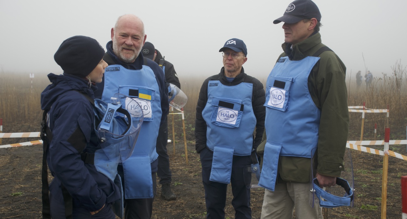 John Jameson, James Cowan and halo staff members stand in a cold Ukrainian minefield