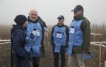 John Jameson, James Cowan and halo staff members stand in a cold Ukrainian minefield